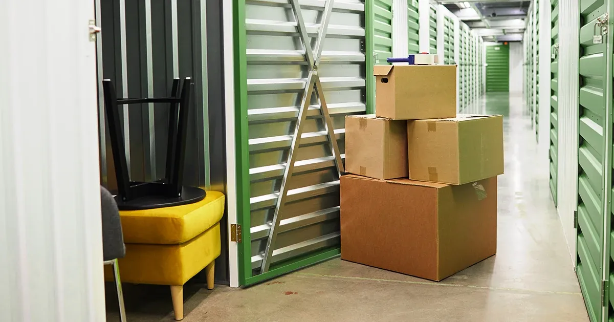 Boxes stacked infront of an open storage unit